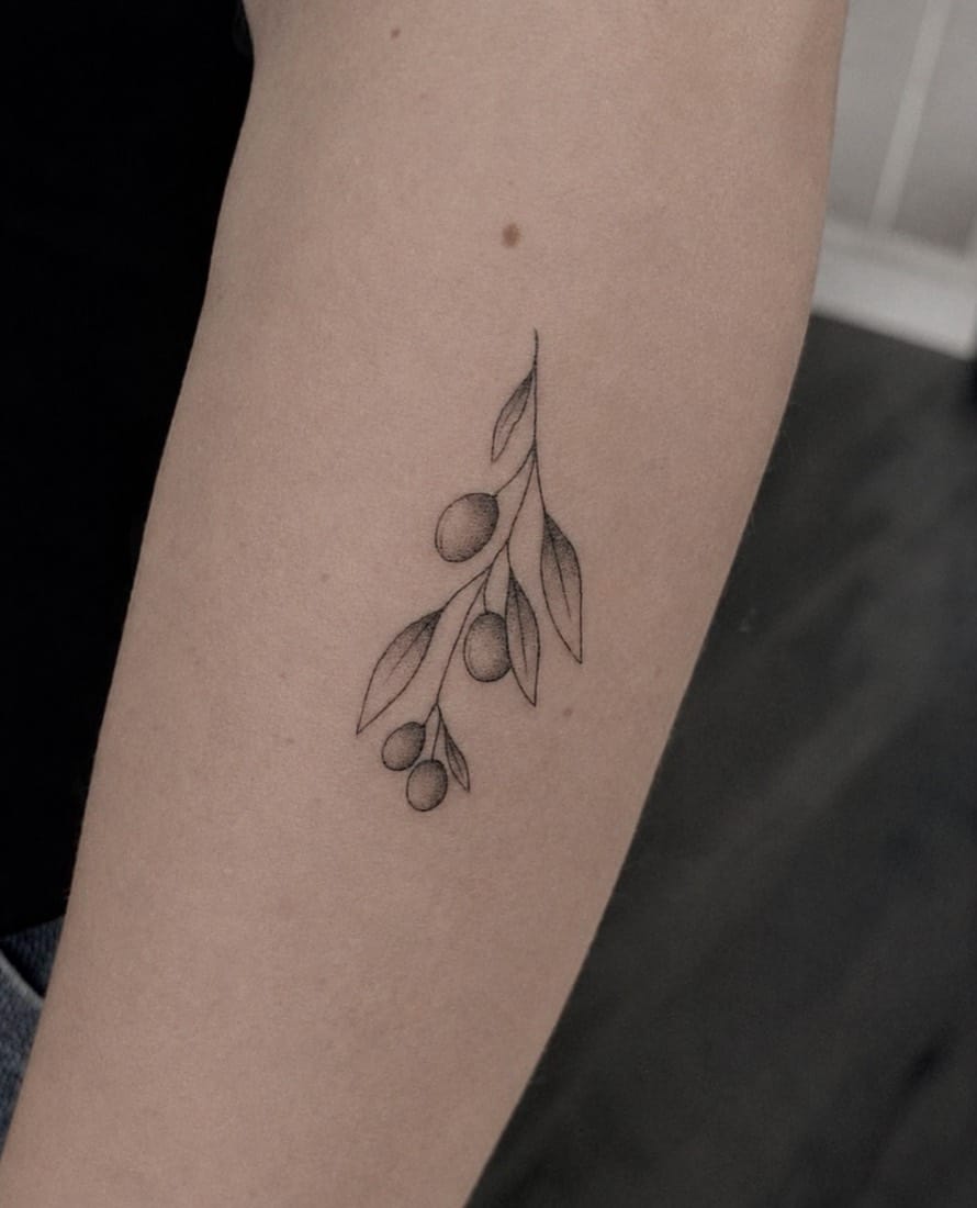 Fine line olive branch tattoo by an Essex Fine Line Tattoo Academy student